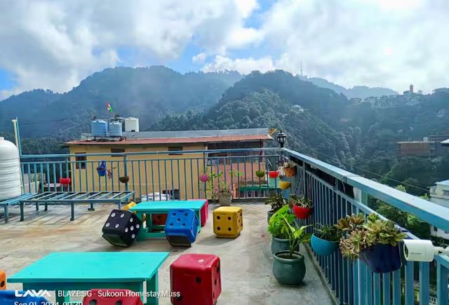 Cozy Couple Room 203  for 2 Guests on Mall Road - Terrace with Landour Clock Tower Mountain View